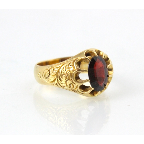 202 - An early 20th century 18ct yellow gold garnet ring, the oval cut garnet in openwork claw setting edg... 