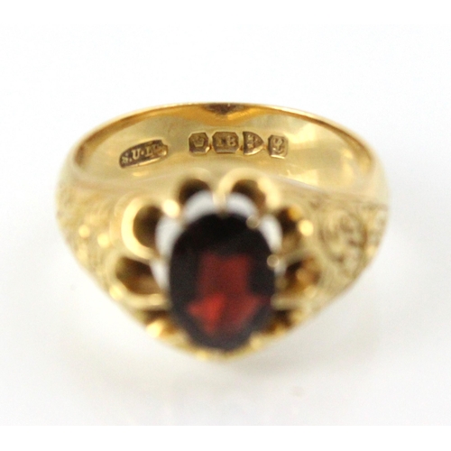 202 - An early 20th century 18ct yellow gold garnet ring, the oval cut garnet in openwork claw setting edg... 