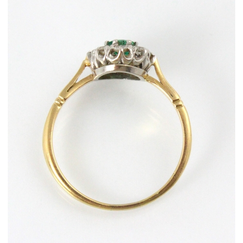 203 - An Edwardian style untested emerald and diamond cluster, the emerald cut green stone within surround... 