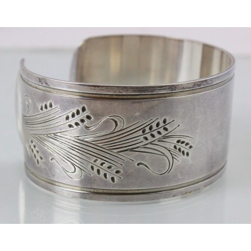 215 - A Georg Jensen silver bangle, the cuff style bangle with wheat design to each terminal, stamped 'Geo... 