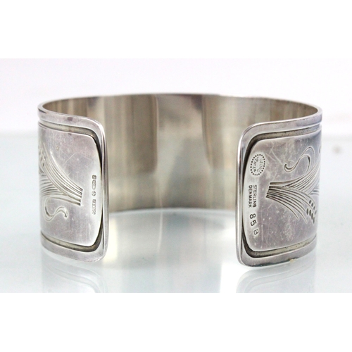 215 - A Georg Jensen silver bangle, the cuff style bangle with wheat design to each terminal, stamped 'Geo... 