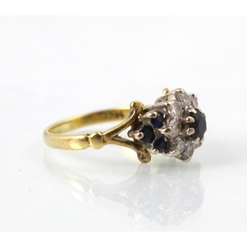 237 - A yellow metal untested sapphire and diamond cluster ring, the central round cut untested sapphire w... 