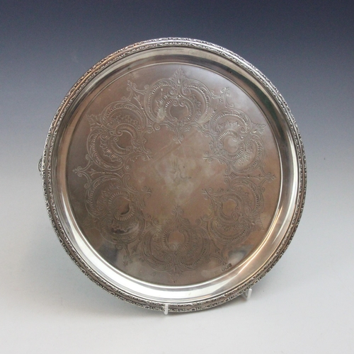 24 - A Victorian silver salver, possibly Lee & Wigfull (makers mark rubbed), London 1894, the cast scroll... 