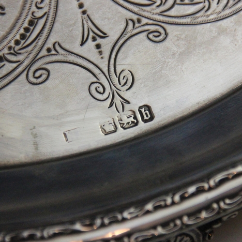 24 - A Victorian silver salver, possibly Lee & Wigfull (makers mark rubbed), London 1894, the cast scroll... 