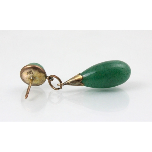 262 - A pair of nephrite earrings, the cabochon studs suspending torpedo shaped dropper, mounted in yellow... 