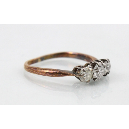 275 - A 20th century diamond three stone ring, the central old cut diamond with smaller diamond to each si... 