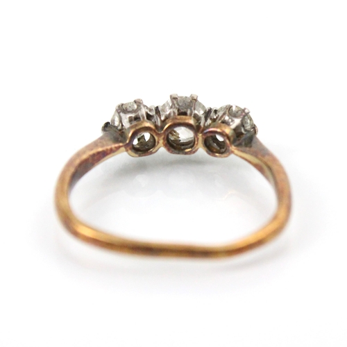 275 - A 20th century diamond three stone ring, the central old cut diamond with smaller diamond to each si... 