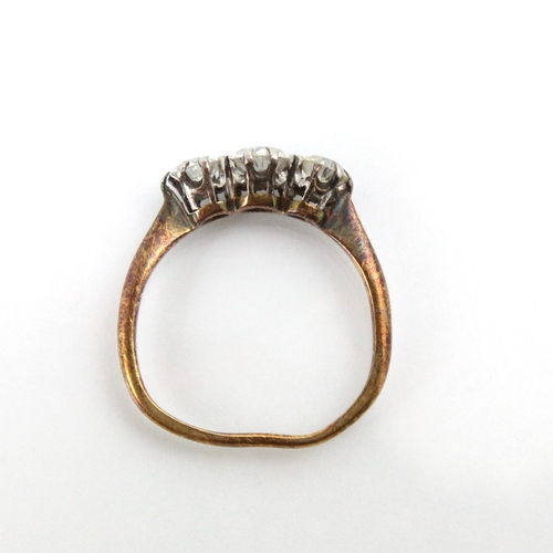 275 - A 20th century diamond three stone ring, the central old cut diamond with smaller diamond to each si... 