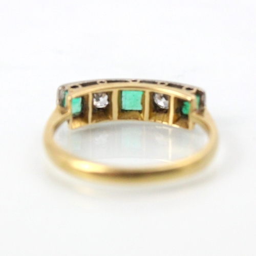 276 - An early 20th century style untested emerald and diamond five stone ring, the two old cut diamonds w... 