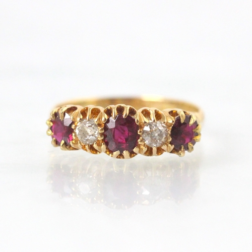 294 - A 19th century untested ruby and diamond five stone ring, the central cushion cut untested ruby with... 