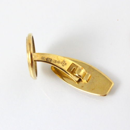 300 - A pair of 9ct yellow gold cufflinks, the oval link engraved 'Greenwich Meridian 2000' with toggle re... 