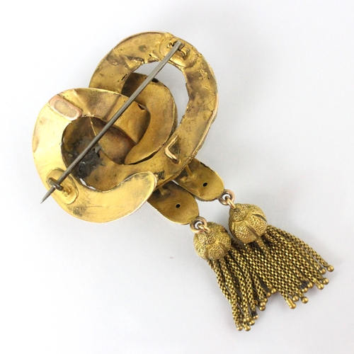 306 - A 19th century gold plated ‘knot’ brooch, the textured ‘knot’ designed brooch suspending double tass... 