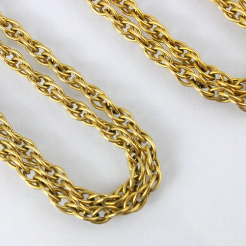 307 - A 9ct yellow gold long guard style chain, the fancy rope twist necklace with bolt ring fastening, st... 