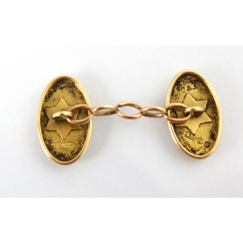 312 - A pair of 19th century 15ct yellow gold cufflinks, the oval plain polished links with star applied d... 