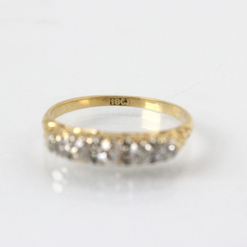 325 - A late 19th century diamond five stone ring, the five graduated old cut diamonds within yellow metal... 