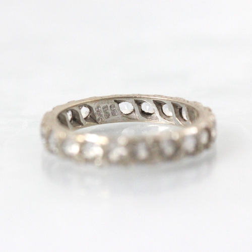 340 - An 18ct white gold untested white sapphire full eternity ring, the twenty round cut white sapphires ... 