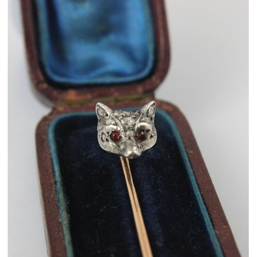 348 - A 19th century diamond set foxes head stick pin, the fox head set with fifteen mixed cut diamonds an... 