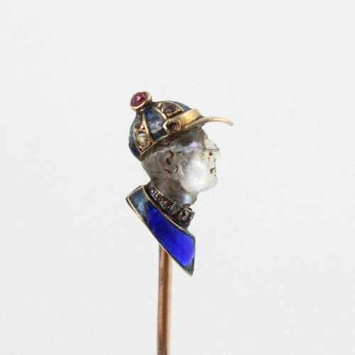 350 - A French carved untested moonstone, diamond and enamel stick pin, the head designed as a side profil... 