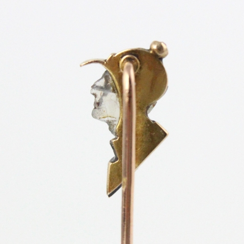 350 - A French carved untested moonstone, diamond and enamel stick pin, the head designed as a side profil... 