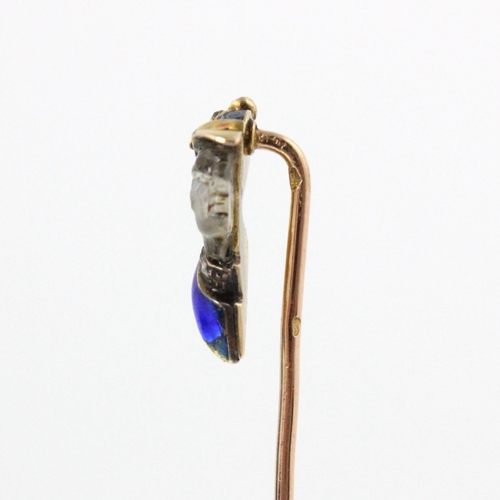 350 - A French carved untested moonstone, diamond and enamel stick pin, the head designed as a side profil... 