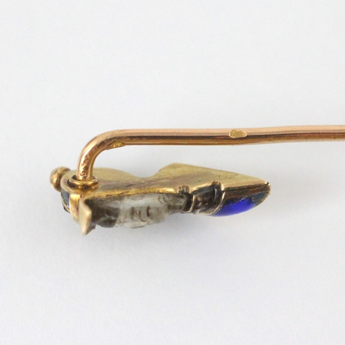 350 - A French carved untested moonstone, diamond and enamel stick pin, the head designed as a side profil... 