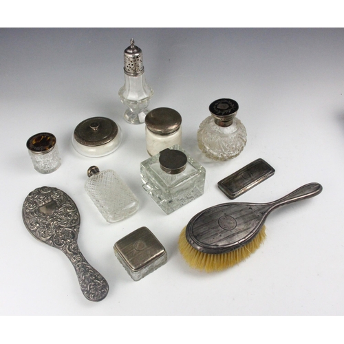 58 - A selection of silver mounted dressing table items, including two early 20th century tortoiseshell p... 