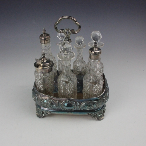 8 - A Victorian silver seven bottle cruet stand, Hawkesworth, Eyre & Co, Sheffield 1863, the fluted doub... 