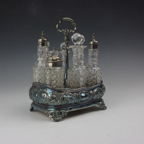 8 - A Victorian silver seven bottle cruet stand, Hawkesworth, Eyre & Co, Sheffield 1863, the fluted doub... 