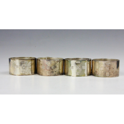 81 - A set of four Britannia silver napkin rings, Joshua Horton & Son, Birmingham 1977, of plain polished... 