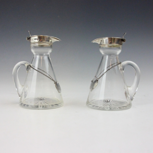 82 - A pair of Edwardian silver mounted whiskey tots or noggins, possibly Marks & Cohen, Birmingham 1908,... 