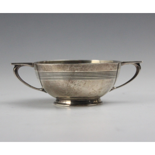 85 - A George V silver twin handled bowl, Selfridge & Co Ltd, Birmingham 1920, the angular handles above ... 