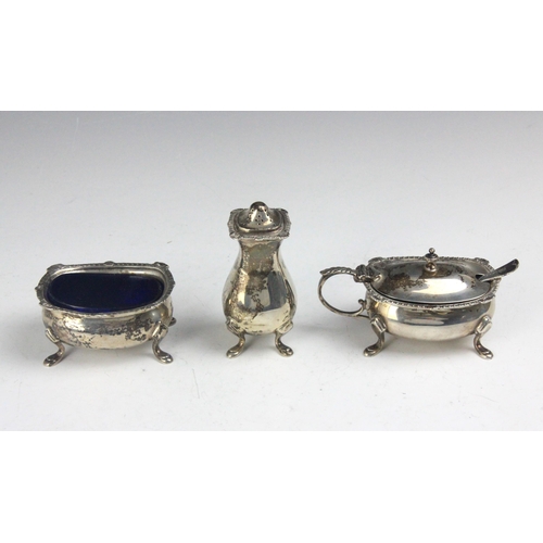 91 - A George V silver condiment set, Walker and Hall, London 1930-33, comprising wet mustard, pepperette... 