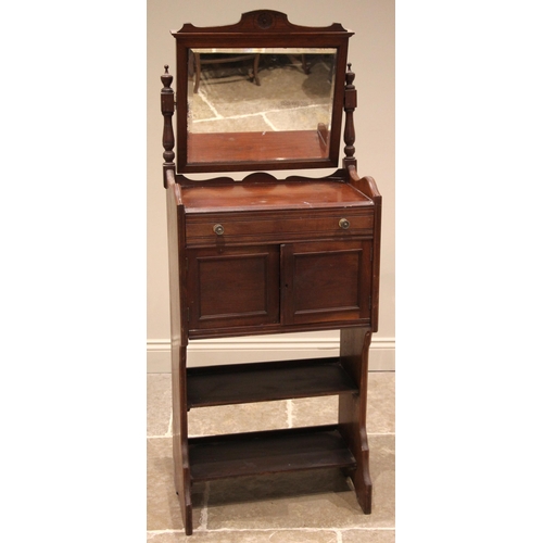 1004 - A late 19th century walnut shaving/vanity stand, the rectangular tilting mirror upon turned baluster... 