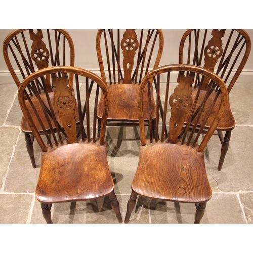 1010 - A set of five ash and elm wheel back kitchen chairs, late 19th century, stamped 'J.S 26', each with ... 