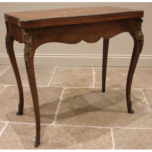 1026 - A Louis XV style kingwood and marquetry serpentine games table, 20th century, the table top inlaid w... 