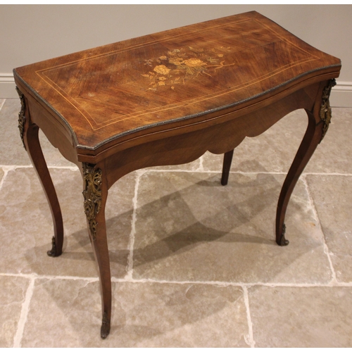 1026 - A Louis XV style kingwood and marquetry serpentine games table, 20th century, the table top inlaid w... 