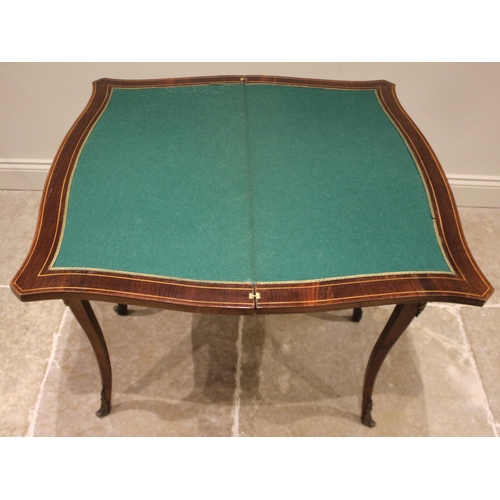 1026 - A Louis XV style kingwood and marquetry serpentine games table, 20th century, the table top inlaid w... 