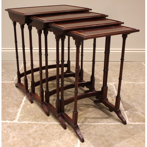 1028 - An Edwardian quartetto nest of mahogany tea tables, each table with a beaded gallery and satinwood c... 