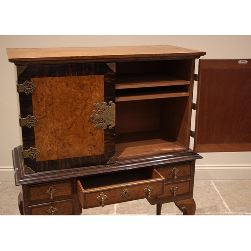 1029 - A 17th century style oak and pollard oak cabinet on stand, by Warings, early 20th century, the pair ... 