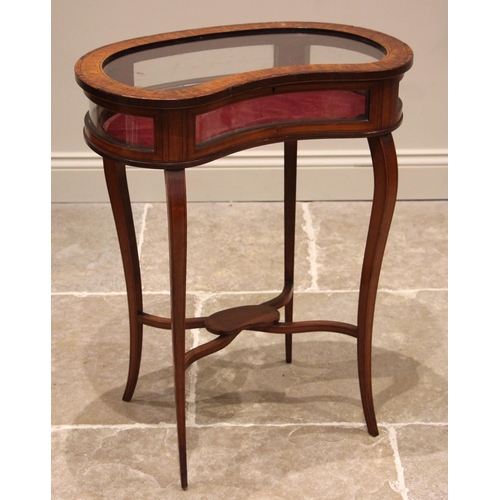 1034 - An Edwardian satinwood kidney shaped bijouterie table, the hinged cover frame inlaid with trailing f... 