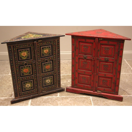 1036 - A painted Indian hardwood freestanding corner cupboard, painted with repeating heraldic shields and ... 