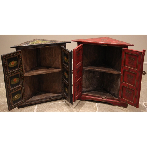 1036 - A painted Indian hardwood freestanding corner cupboard, painted with repeating heraldic shields and ... 