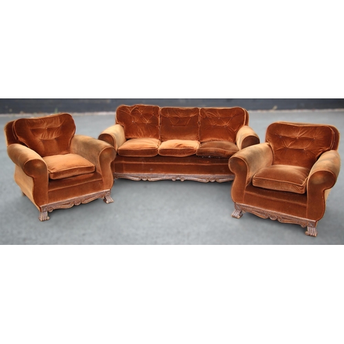 1039 - A carved oak and brown velour Jacobean revival three piece lounge suite, circa 1920, the three seate... 