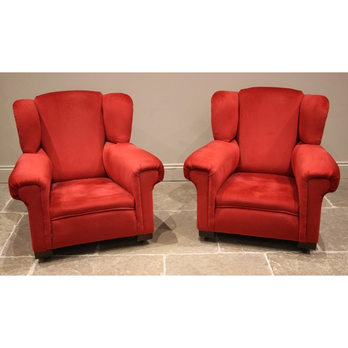 1040 - A pair of early 20th century Gentleman’s club-type armchairs, each upholstered in claret velour, rai... 