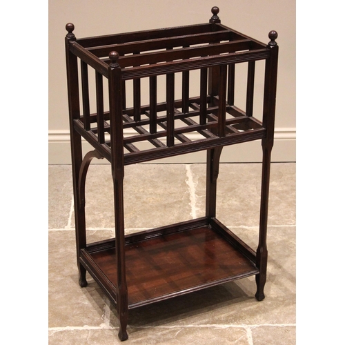 1042 - An Edwardian mahogany elevated magazine rack/Canterbury, the sphere finials over three compartments,... 