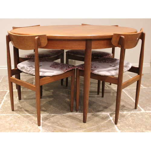 1056 - A G-Plan Fresco teak dining table, mid 20th century, the circular top with an integral folding leaf,... 