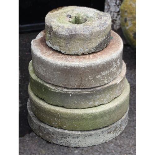 1091 - Five assorted and graduated sandstone mill stones, from 25cm D to 38cm D (5)