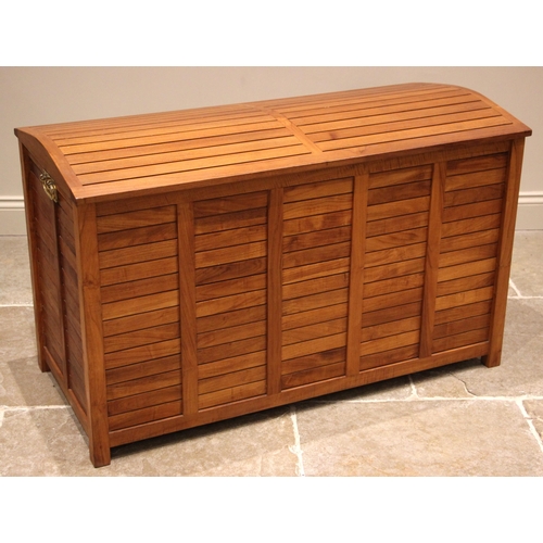 1111 - A Smart Wood plantation teak patio storage chest, of slatted form, the gently domed cover opening to... 