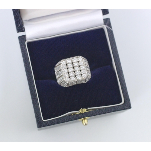 177 - An Italian white gold diamond set cocktail ring, the square shaped head with round cut diamonds set ... 