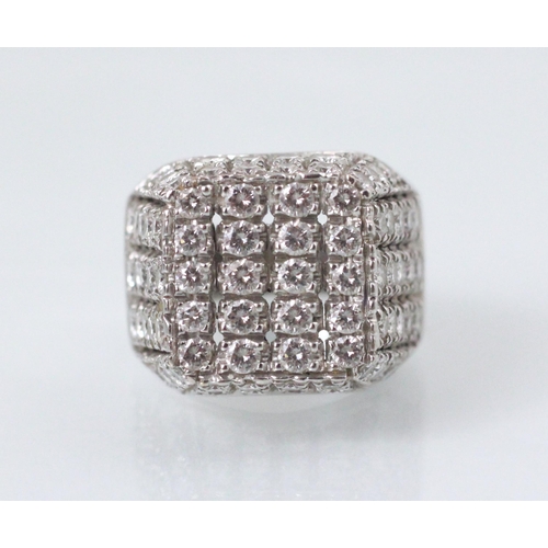 177 - An Italian white gold diamond set cocktail ring, the square shaped head with round cut diamonds set ... 